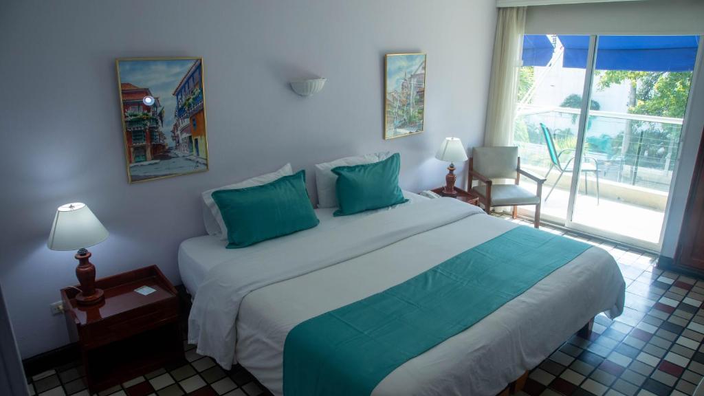Postel nebo postele na pokoji v ubytování Hotel Bahia Cartagena