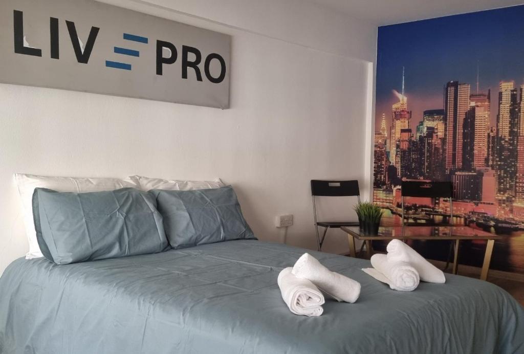 Postel nebo postele na pokoji v ubytování LivePro