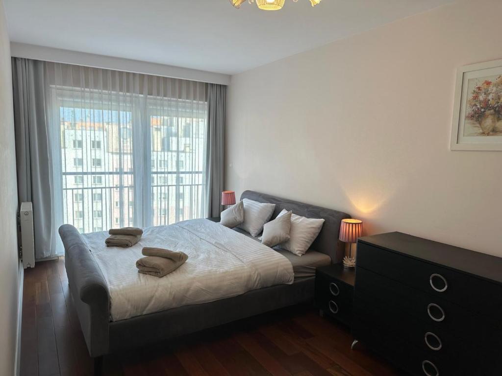 Llit o llits en una habitació de Apartament Nad Zalewem