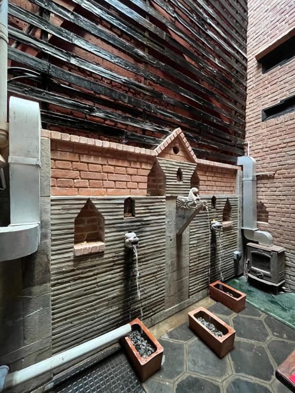 a model of a kitchen in a brick wall at NEWA:INN in Kathmandu