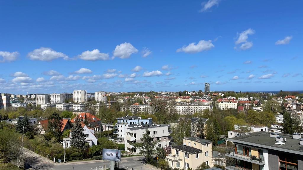 a view of a city with buildings and trees at Gdynia Riviera Hills in Gdynia