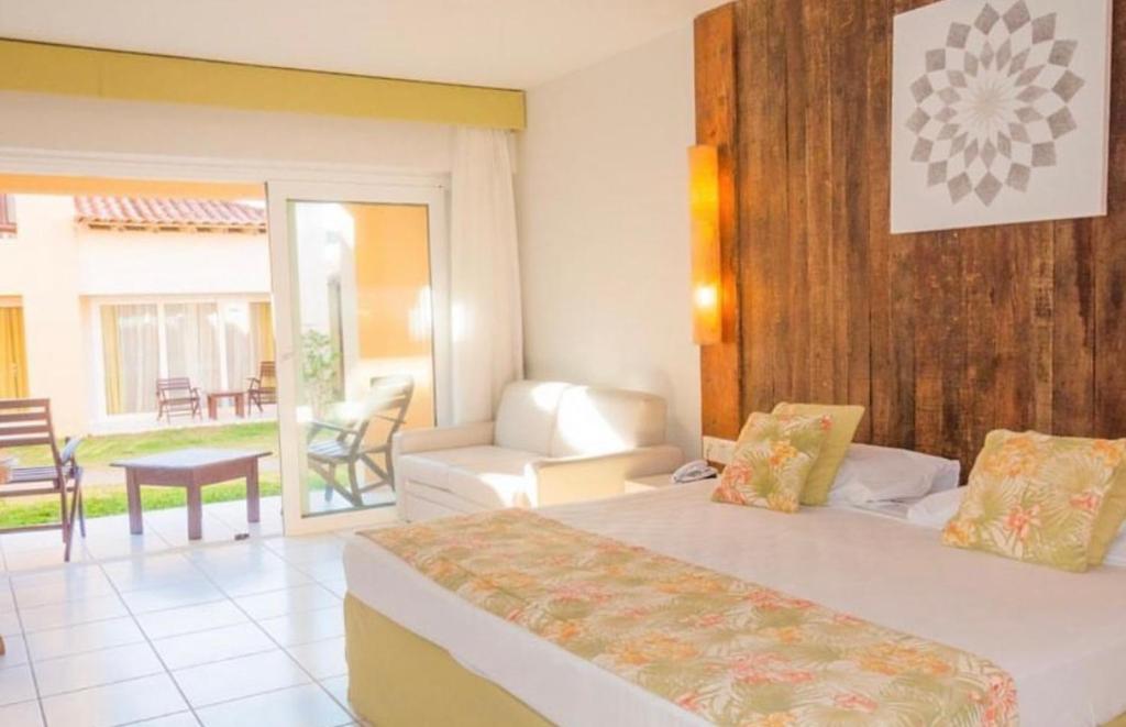 Una cama o camas en una habitación de Búzios Beach Resort