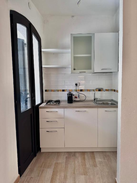 Kuchyň nebo kuchyňský kout v ubytování Villa La Caletta