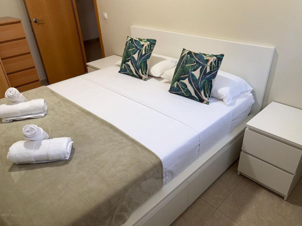 a hotel room with a bed with towels on it at Family Relax Salou in Salou