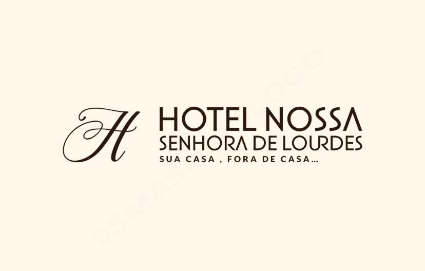 特林達德的住宿－Hotel Nossa Senhora de Lourdes，洛杉矶法兰西斯科地标酒店的标志