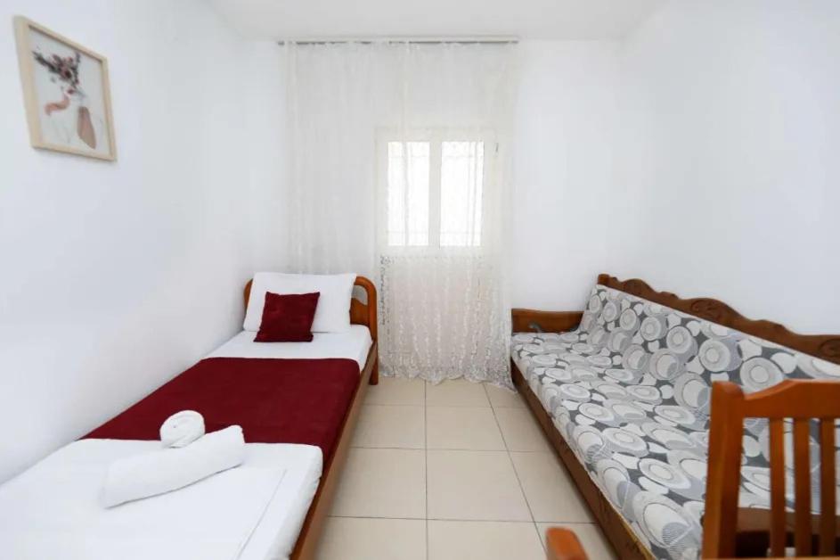 Postel nebo postele na pokoji v ubytování Vila Agolli
