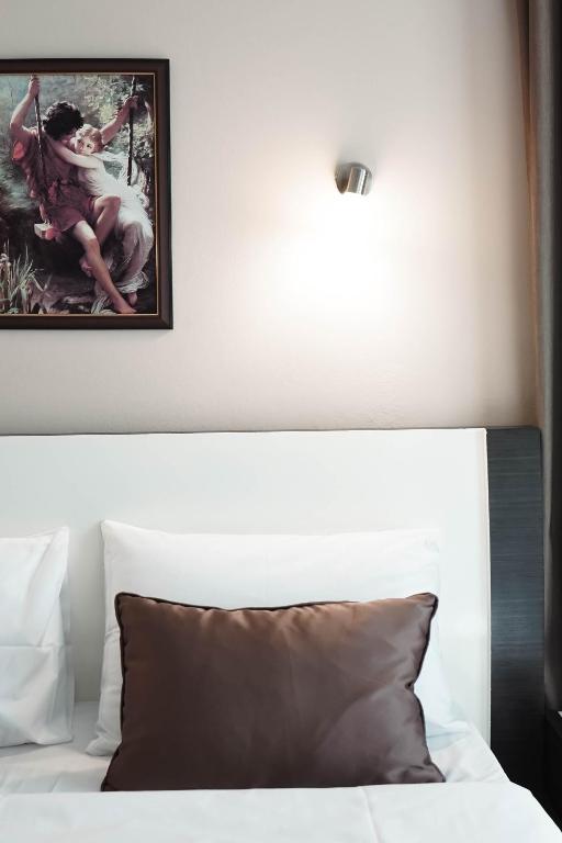 Postel nebo postele na pokoji v ubytování Hotel Kristal