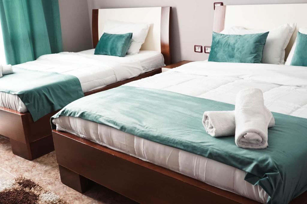 Postel nebo postele na pokoji v ubytování Hotel Kristal