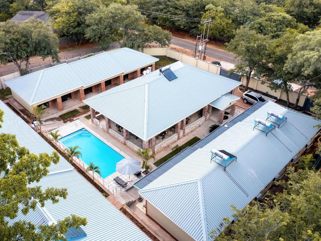 an overhead view of a house with a swimming pool at The Shrub Lodge in Victoria Falls