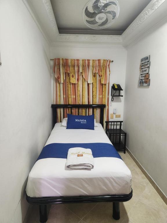 Voodi või voodid majutusasutuse Hotel Manoa toas