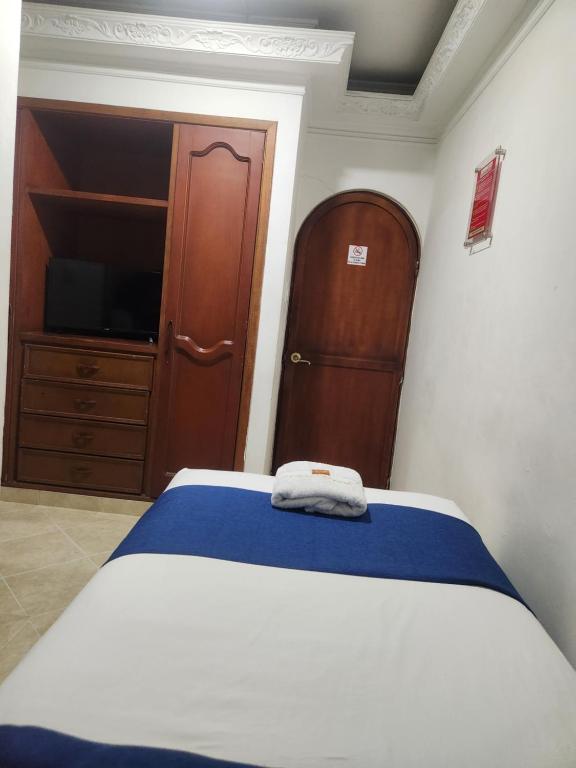 Voodi või voodid majutusasutuse Hotel Manoa toas