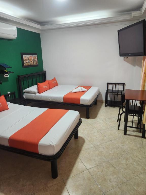 Voodi või voodid majutusasutuse Hotel Manoa toas