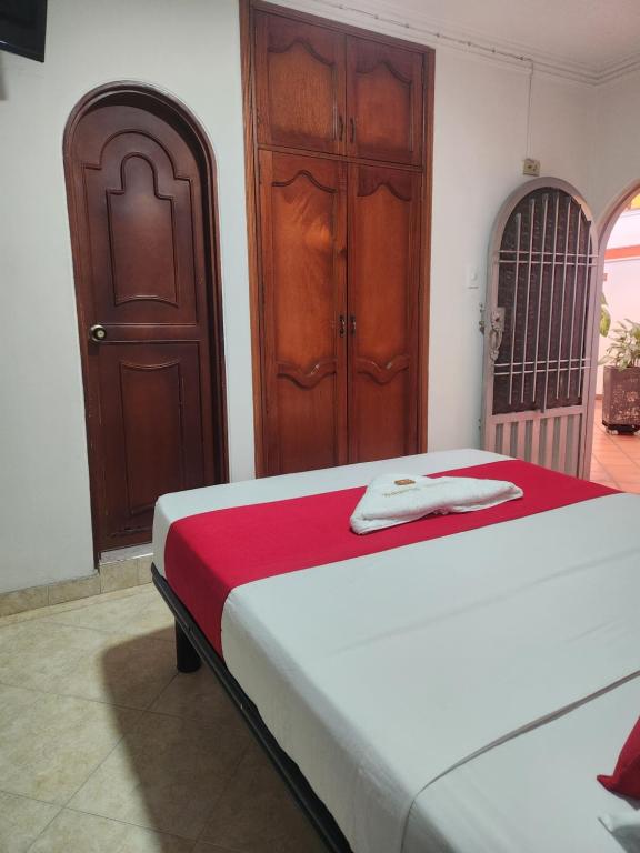 Voodi või voodid majutusasutuse Hotel Manoa toas