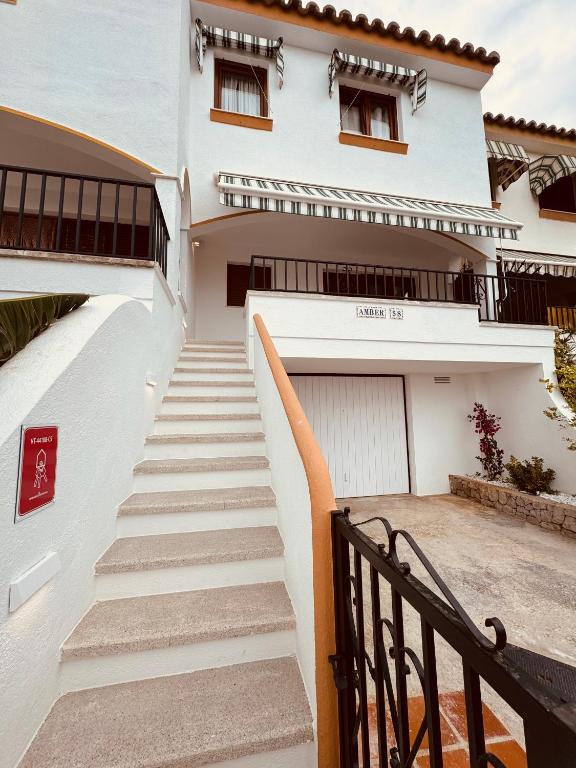 a stairway leading up to a white house at Amber Holiday Home in Peniscola