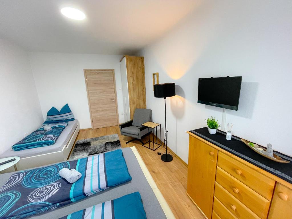 Postel nebo postele na pokoji v ubytování Moderne Ferienwohnung Felbbauer #50