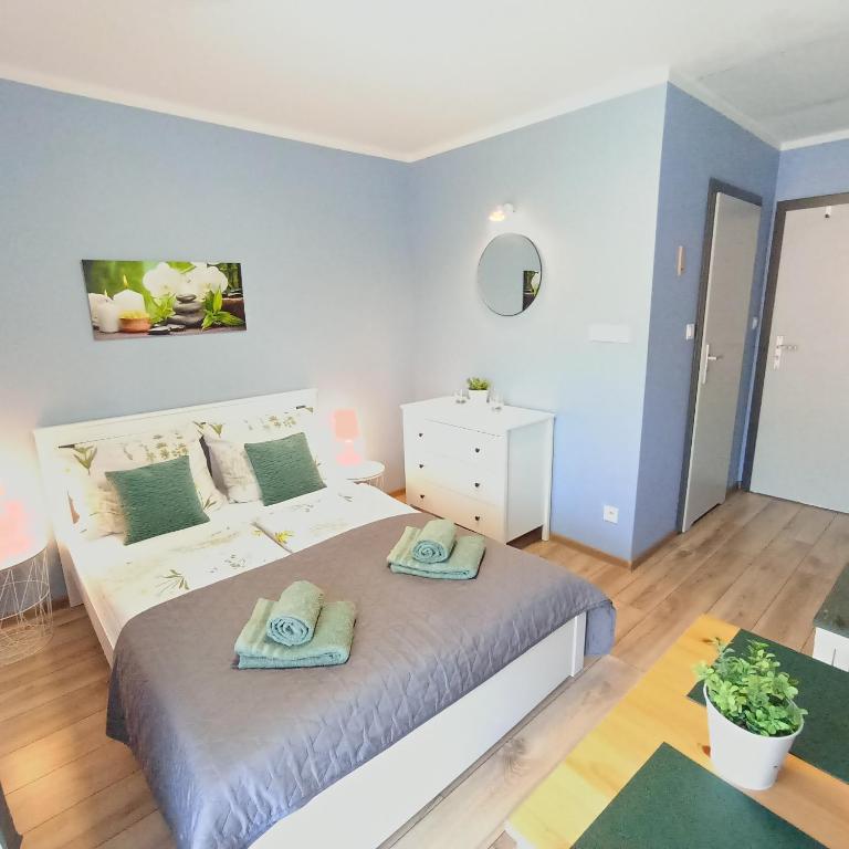 Posteľ alebo postele v izbe v ubytovaní Apartamenty Gościnne Idylla