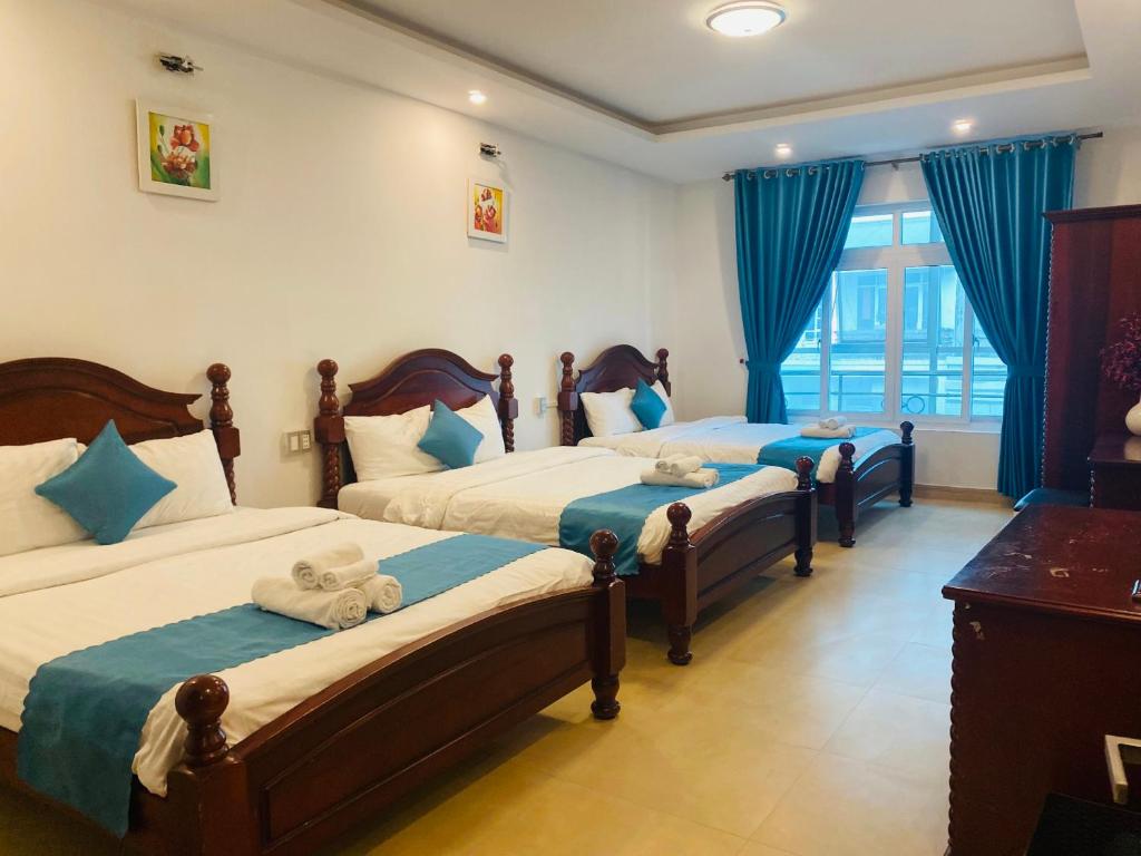 Кровать или кровати в номере Thien Sang Hotel and Billiards club 255