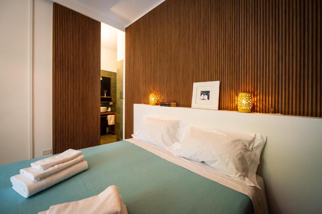 Postel nebo postele na pokoji v ubytování B&B Lu Cuccuviu a Mare