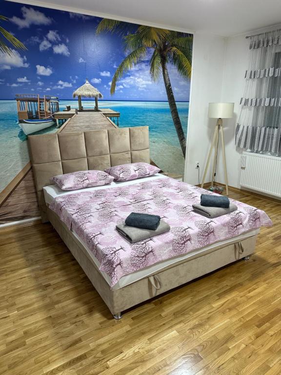 Кровать или кровати в номере Maldivi Apartman