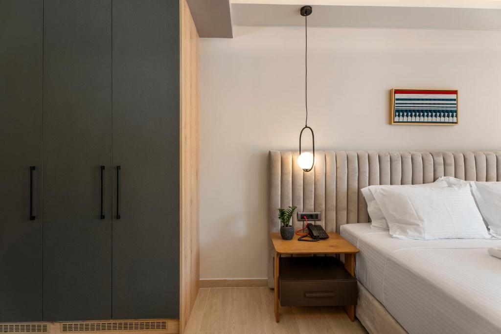 Postel nebo postele na pokoji v ubytování Ennea Muses Rooms and Suites