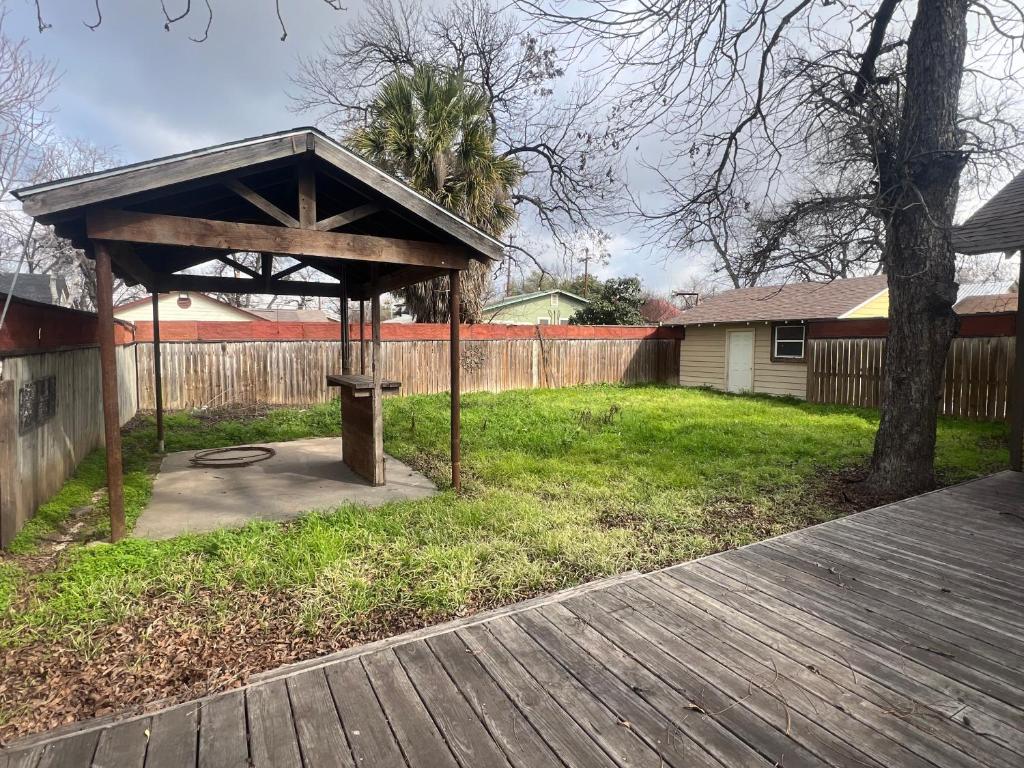 a picnic shelter in a yard with a tree at Private room in southern home in San Antonio
