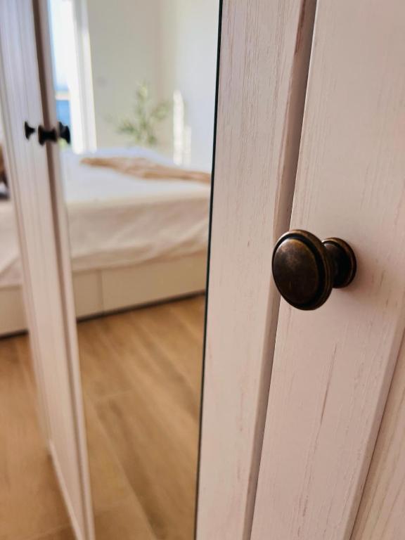 Postel nebo postele na pokoji v ubytování BohoSol House