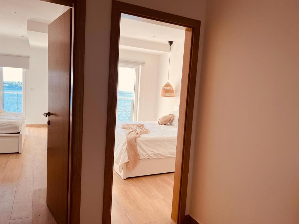 Postel nebo postele na pokoji v ubytování BohoSol House