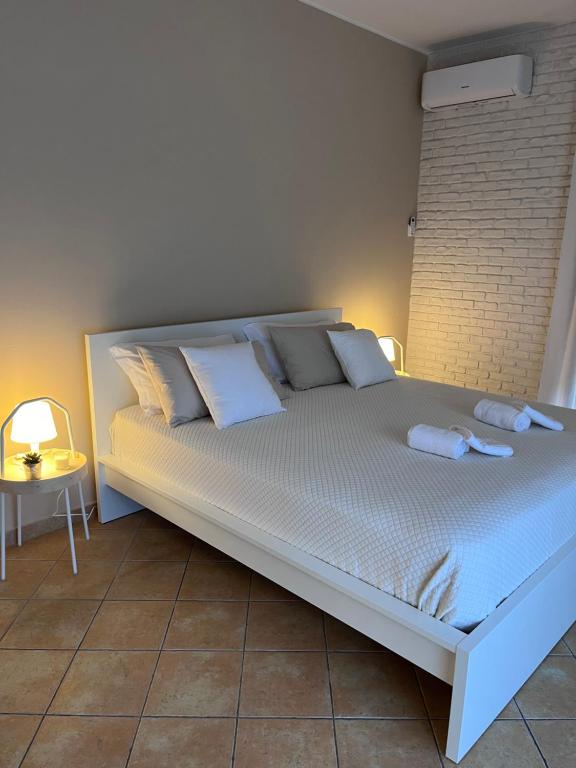 Uma cama ou camas num quarto em Villa Maria Palese