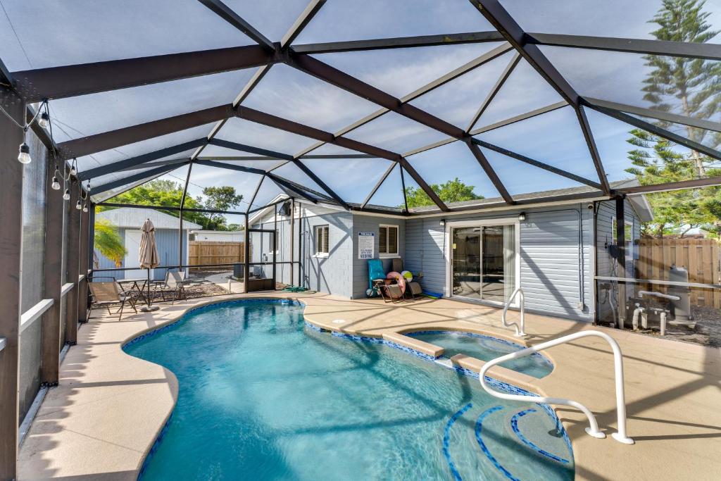 a swimming pool in a house with a roof at South Daytona Home Game Room, Private Pool! in South Daytona