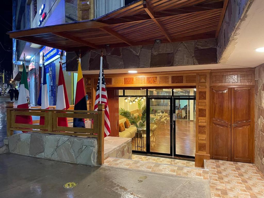 a store front with flags in a building at Gran Kunturwasi Hotel Corporativo in Cajamarca