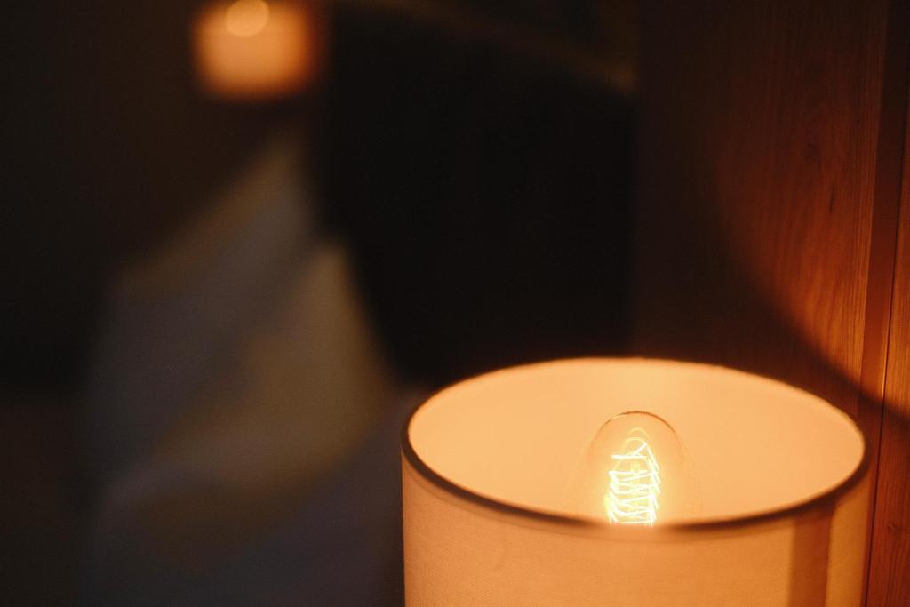 a close up of a candle in a room at PARKHOTEL - Rosarium in Uetersen