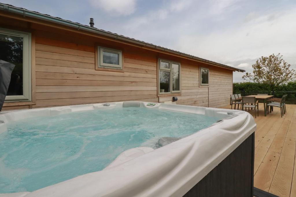 a large hot tub in front of a house at 6 Faraway Fields in Liskeard