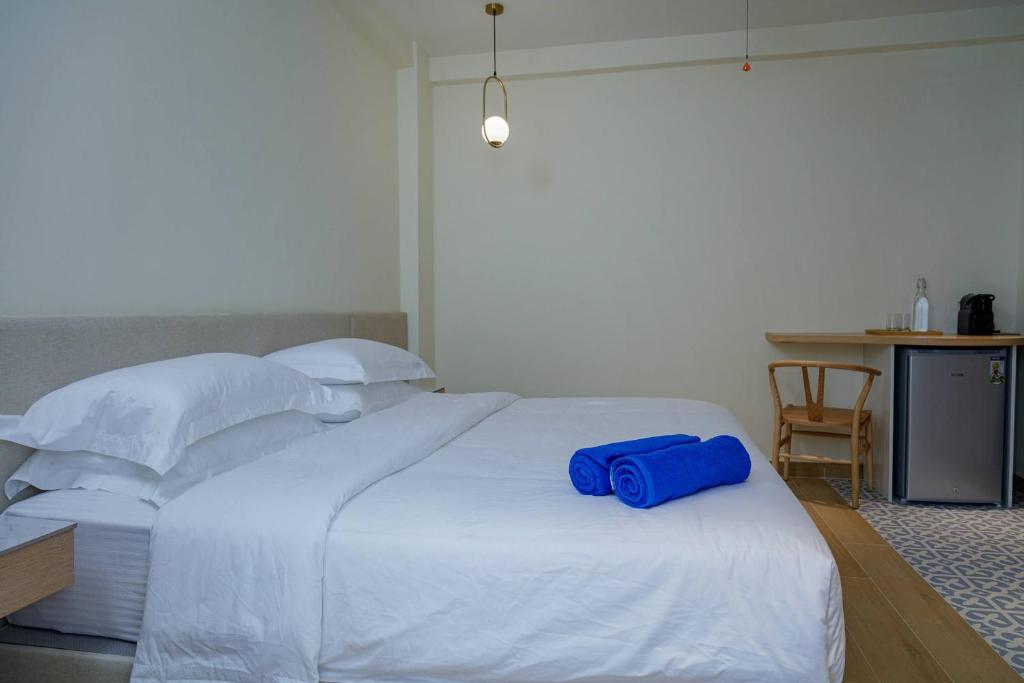 Postel nebo postele na pokoji v ubytování Kinan Boutique