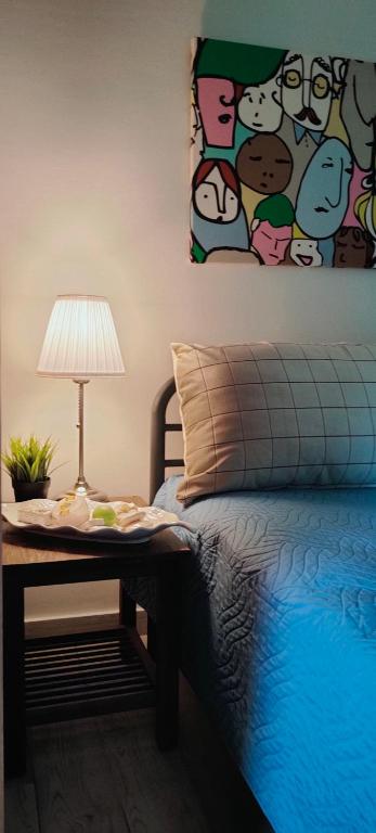 Postel nebo postele na pokoji v ubytování Cosy Garden Studio