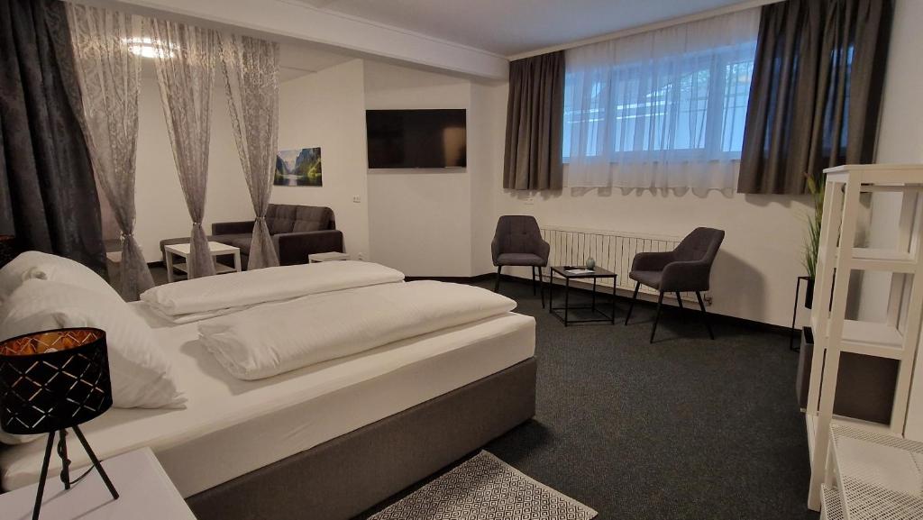 Кровать или кровати в номере Fremdenzimmer& Appartementhaus Blassnig