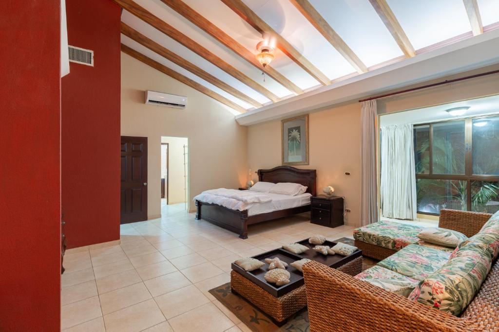 Postel nebo postele na pokoji v ubytování Green Villas El Coco