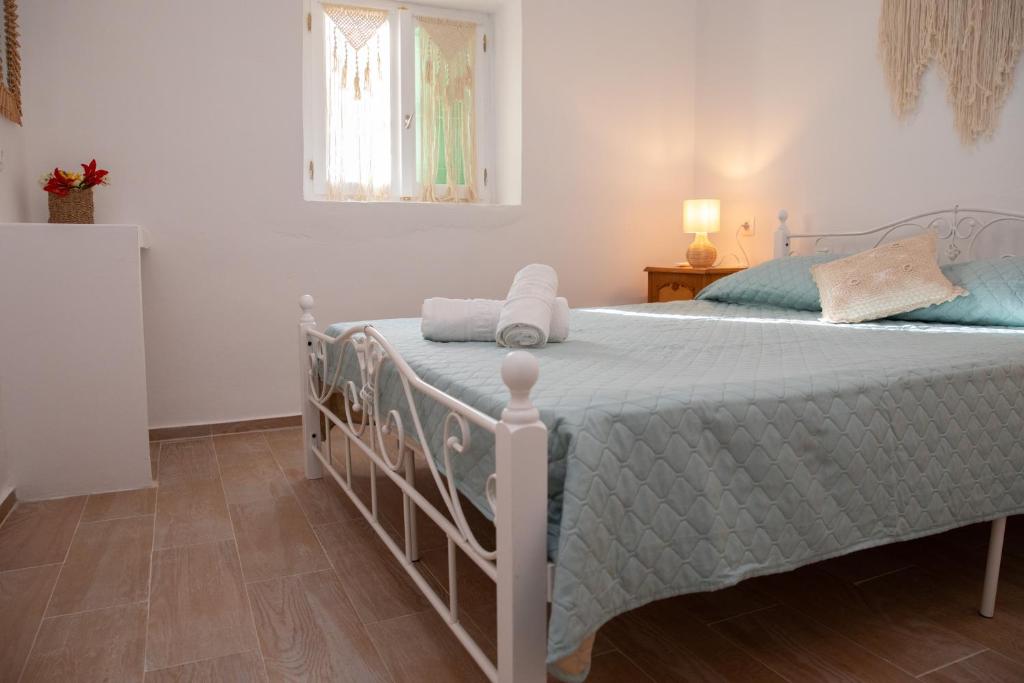 Postel nebo postele na pokoji v ubytování Melitini's House