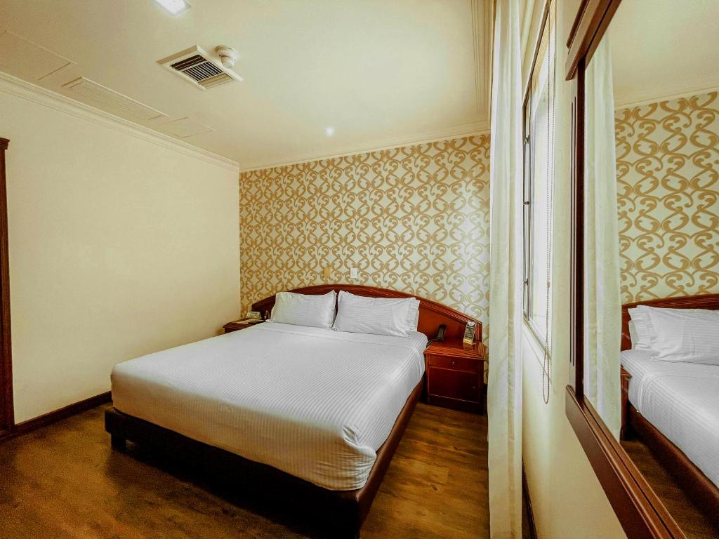 Postel nebo postele na pokoji v ubytování Hotel Castilla Real