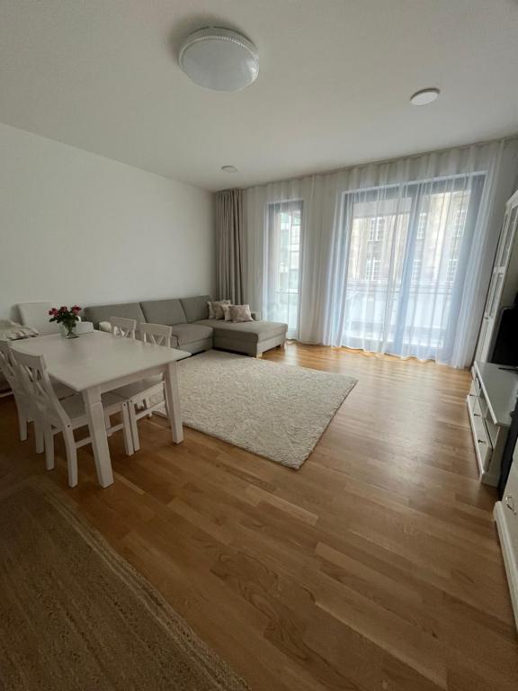 a living room with a table and a couch at New and modern flat between Potsdamer Platz and Tiergarten in Berlin