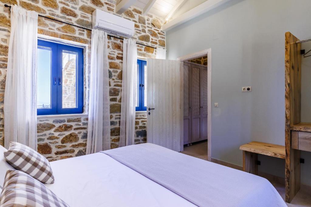 A bed or beds in a room at RODON Luxury Villas