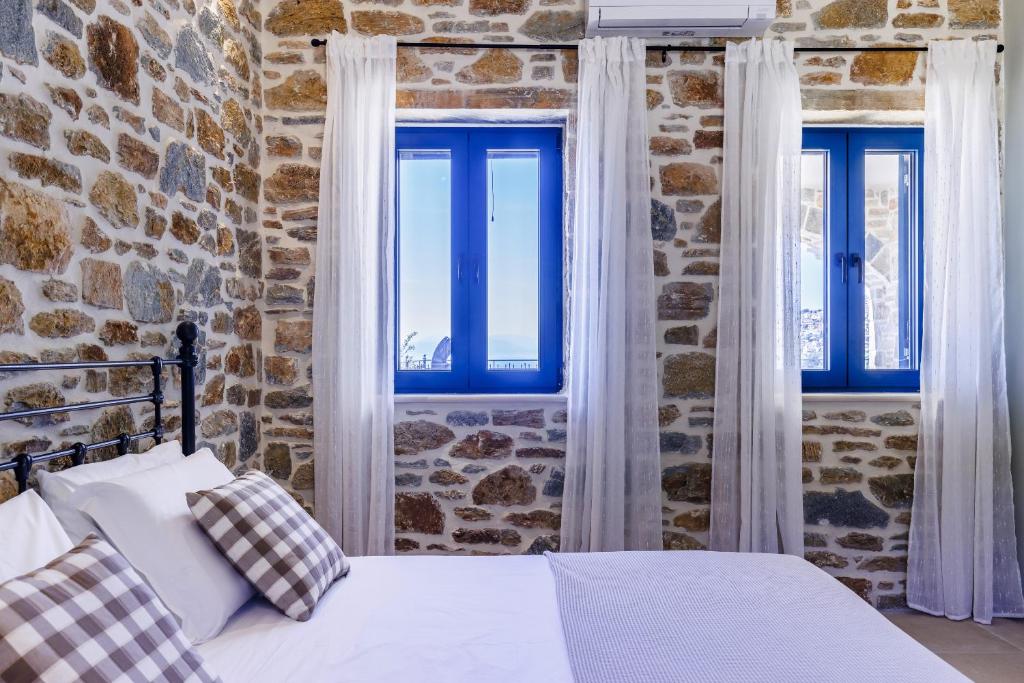 A bed or beds in a room at RODON Luxury Villas