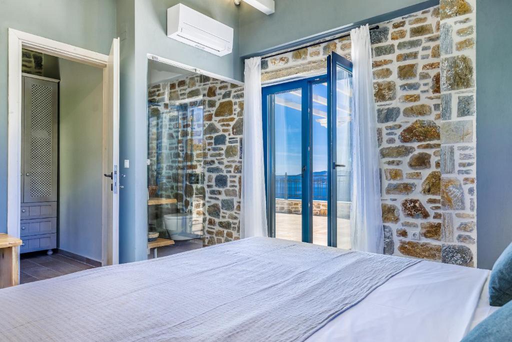 A bed or beds in a room at RODON Luxury Villas
