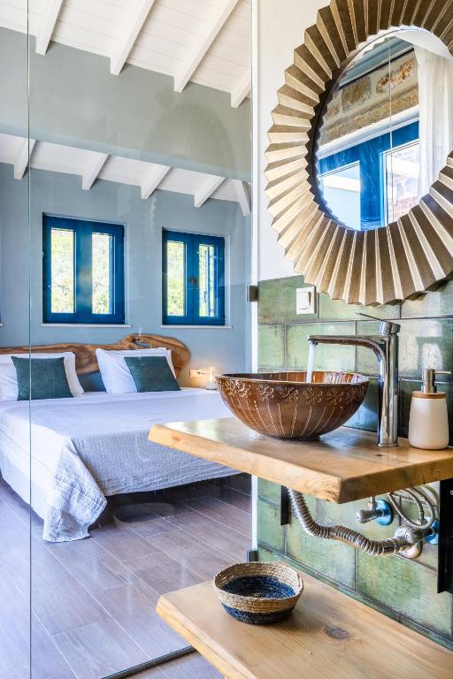 A bed or beds in a room at RODON Luxury Villas