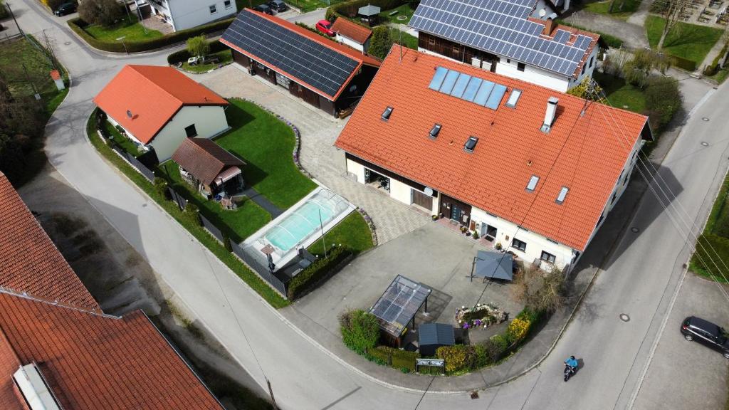 an overhead view of a house with solar panels on it at AMW Ferienwohnungen in Legau