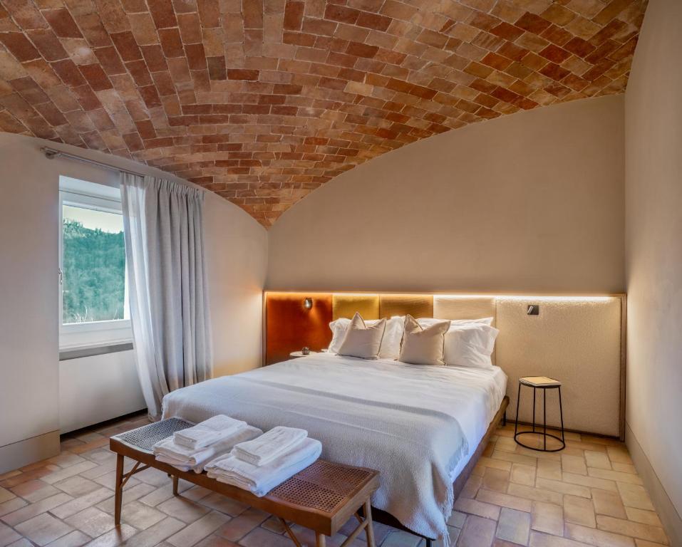 Postel nebo postele na pokoji v ubytování Relais Dal Cavaliere