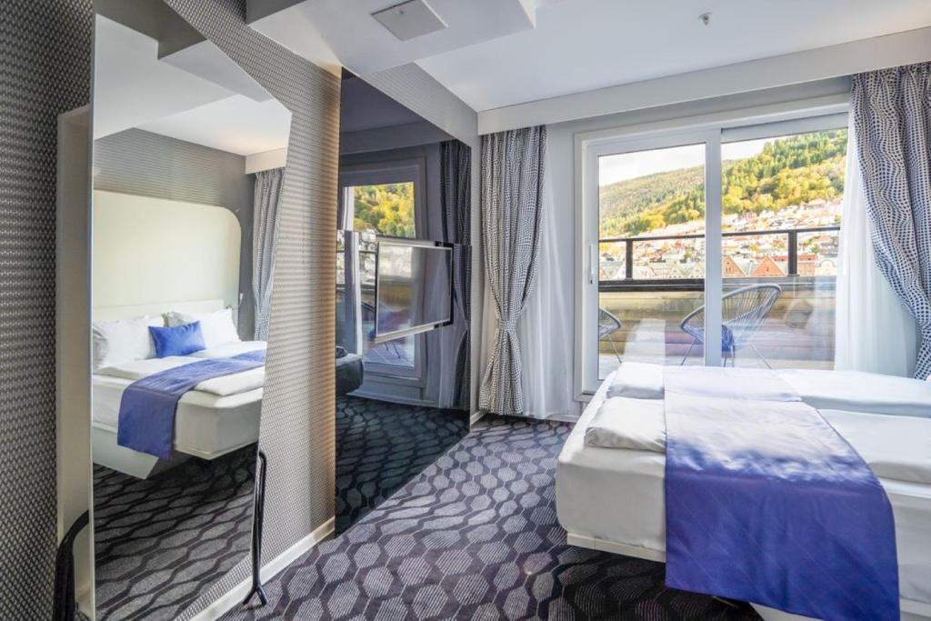 Postel nebo postele na pokoji v ubytování Magic Hotel & Apartments Kløverhuset