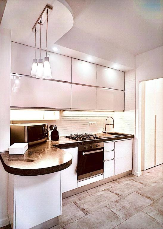 Kuchyň nebo kuchyňský kout v ubytování Maison Du Pic - Rho Fiera