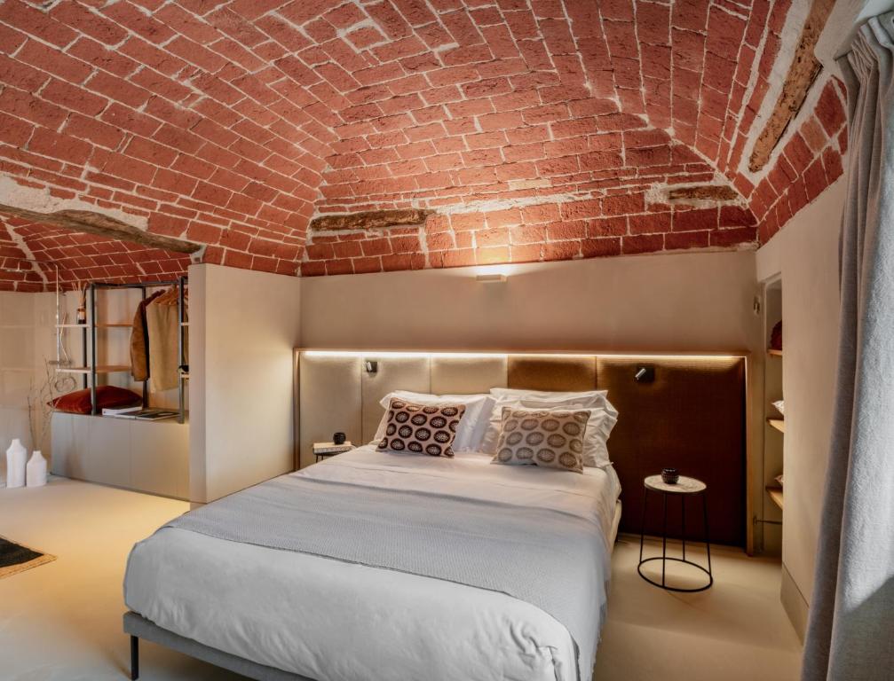 Postel nebo postele na pokoji v ubytování Relais Dal Cavaliere