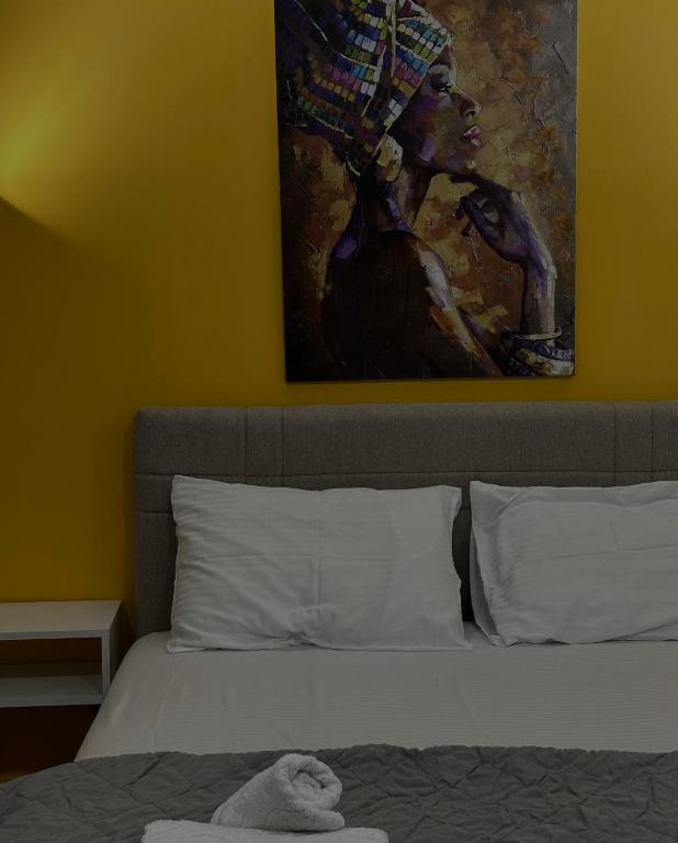 Postel nebo postele na pokoji v ubytování Vila Storia