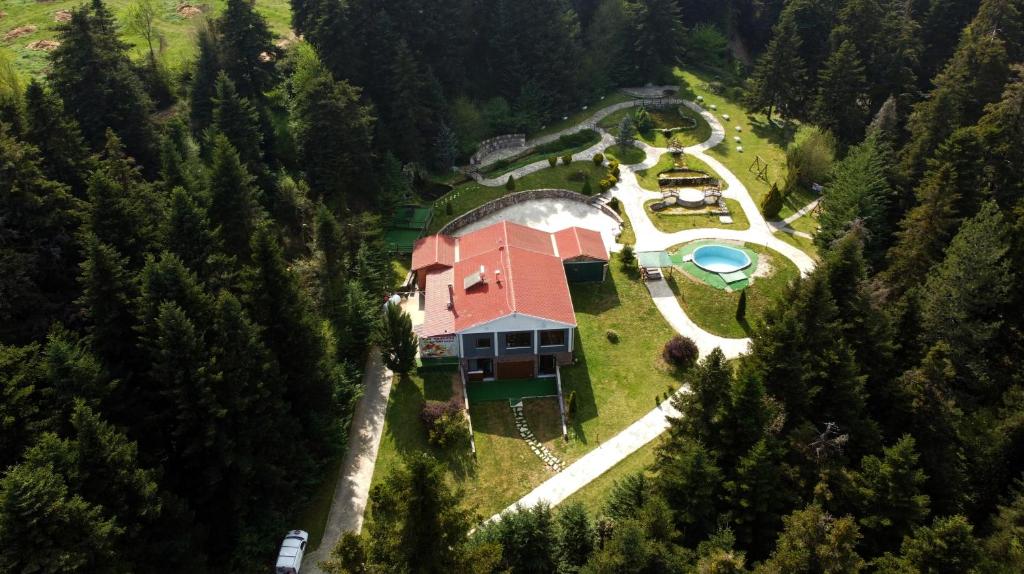 an aerial view of a house in the middle of a forest at ECO VILLA OLYMPUS with sauna in Kariá